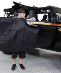 Person holding Front Door Storage Bags For Ford Bronco 2021 And Up Front Doors Only 1 Pair Beefed Up Heavy Duty Fabric Pouches.