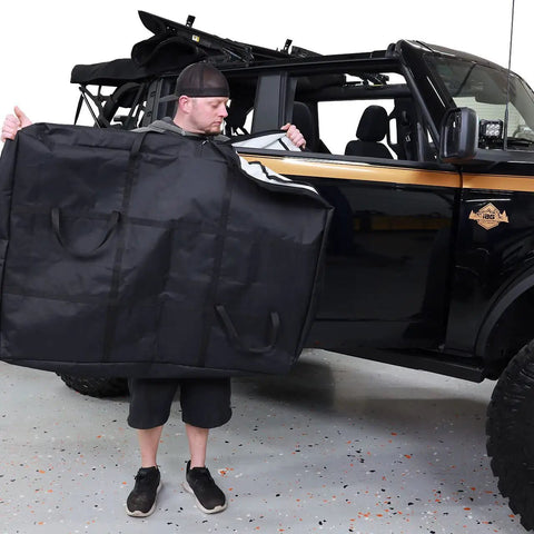 Person holding Front Door Storage Bags For Ford Bronco 2021 And Up Front Doors Only 1 Pair Beefed Up Heavy Duty Fabric Pouches.