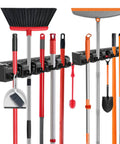 Broom And Mop Organizer Wall Mount 2 Pack with 5 ball slots and 6 hooks in black, holding cleaning tools in kitchen or garage.