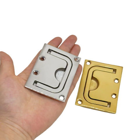 Hand holding 316 Stainless Steel Flush Pull Ring Handle in Gold Finish and silver variant, 76x57mm, rust resistant, for marine and cabinet use.