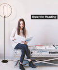 Woman reading beside Torchiere-Style No-Fuss Dimmable LED Floor Lamp For Living Rooms And Offices, Super Bright Tall Standing Lamp