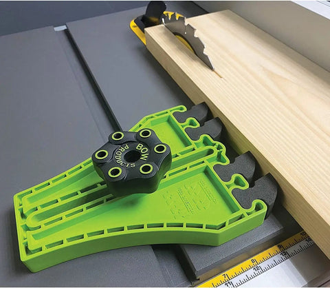 Portable Saw Featherboard Crafted For 5/8 Or 3/4 Slot With Rock Solid Eva Foam positioned on table saw with wooden board.