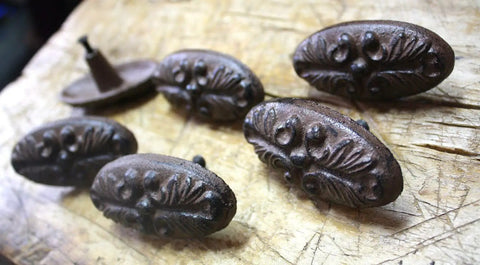 Old School Cast Iron Drawer Pull Set 20 Piece Vintage Victorian Style Oval Barn Door Handles on rustic wood surface