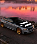 Car with Puerto Rico black and white flag hood cover beside a lake at sunset, ultra stretchy polyester spandex. Universal fit for cars.