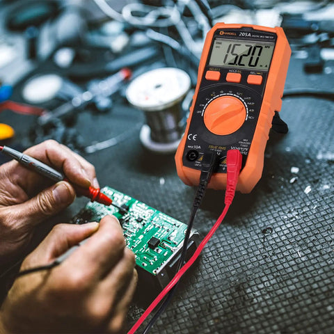 Digital Multimeter TRMS 6000 Counts Auto Ranging DMM With NCV Backlight and Flashlight measuring a circuit board