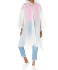 Adult wearing Lightweight Hooded Packable Poncho With Side Snaps For Adults Travel Ready Rain Gear That Packs Into Its Pouch indoors