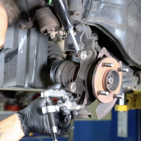 Mechanic using Hydraulic Ball Joint Separator Kit With 8 Ton Capacity No More Pickle Forks Needed Safe And Powerful Joint Splitter