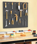 Beefy Pegboard Wall Organizer Kit For Garage And Shed 30 By 60 Cm Metal Pegboard Panels With Tool Storage installed on wall.