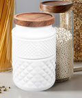 Dope Vintage Matte White Glass Canisters Set With Solid Wood Airtight Lids For Coffee Beans Tea And Grains on countertop.
