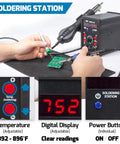 Hands using 2 In 1 Hot Air Rework Soldering Station Kit with desoldering tool, digital display, and circuit board