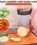 Crinkle cutter with stainless steel wavy blades and black ergonomic handle for slicing potatoes and vegetables