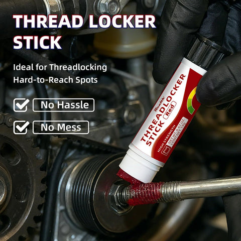 Applying red high strength threadlocker stick to a bolt for secure, vibration-resistant locking in machinery repair.