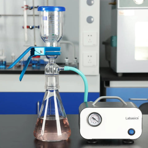 Vacuum Filtration Set With Borosilicate Glass Filter Flask 1000 Milliliters, 10 Micron Sand Core Filter Plate, And 300 Milliliters Graduated Beaker For General Filtration And Precise Vacuum Filtration In The Lab with pump and tubing on lab bench.
