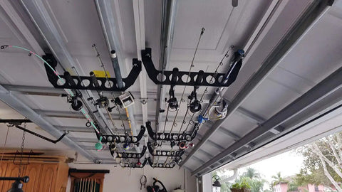 Garage door storage rack for fishing gear 21 inch black ABS rod holder allows saltwater tackle organization without tools.