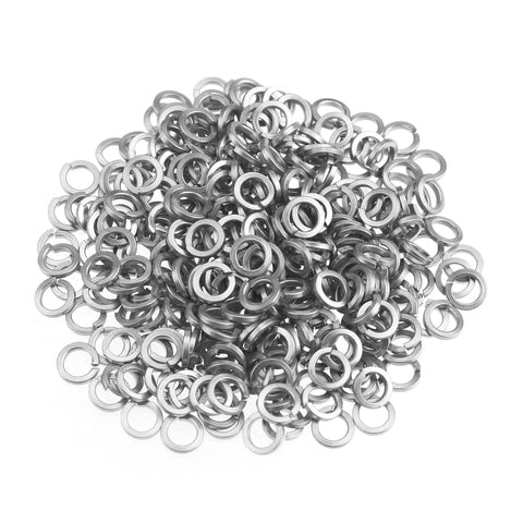 Split lock washers; pile of small silver stainless steel washers, top view