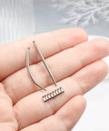 14G Piercing Taper Kit With 2mm Titanium Extension Poles displayed in hand showing tapers and poles.