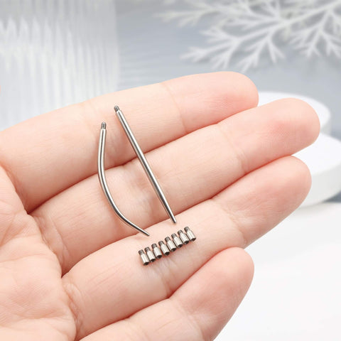 14G Piercing Taper Kit With 2mm Titanium Extension Poles displayed in hand showing tapers and poles.