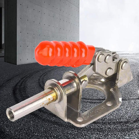 Professional Grade 304 Stainless Steel Toggle Clamp For Woodworking Quick Release Push Pull Hold Down Workbench Fixture Tool With Dead Solid 136 Kg Grip That Locks Real Tight with orange handle and metallic body.
