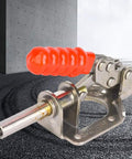 Built Tough Sus304 Stainless Steel Push Pull Quick Release Toggle Clamp With Rock Solid Grip For Heavy Metal Fabrication Welding Jigs And Shop Bench Assembly with orange rubber grip, stainless steel body.