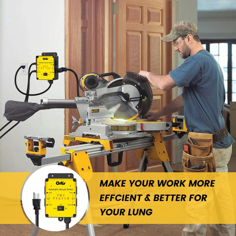 Installed Ortis Automatic Vacuum Switch unit mounted beside a miter saw dust-collection system with a yellow control box.