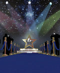 Red carpet event setup with Four Pack Blue Velvet Stanchion Ropes 5 Feet Long With Gold Clasps, star backdrop, and photographers.