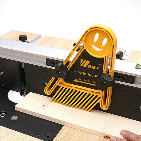 Feather Loc Board Set for Woodworking Table Saws and Engraving Machines doubling as a push block on a workbench with 13 angled fingers