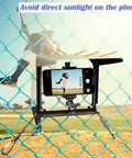 Fence Mount With Sun Shield For Phones And Action Cameras Secure Phone Holder Kit capturing baseball game on fence.