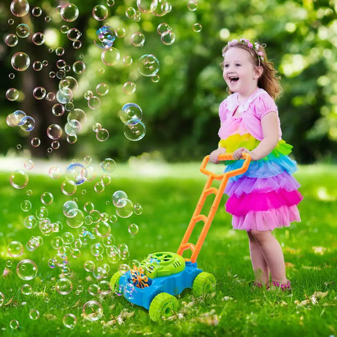 Toddler playing with Bubble Lawn Mower Toy With Realistic Sounds And Bubble Maker For Toddlers Tot Aged 1 To 3 Years in garden