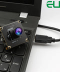 Dope 48MP USB Camera Module With Wide Angle Lens connected to a laptop keyboard, showcasing versatility for PC use.