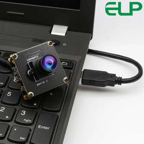 Dope 48MP USB Camera Module With Wide Angle Lens connected to a laptop keyboard, showcasing versatility for PC use.