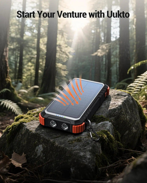 High Capacity Solar Power Bank 45800mAh with Fast Charging and Three Built In Cables, outdoor on rock in forest