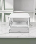 Clear Stackable Storage Bins With Transparent Slide Front Doors, clear plastic bin with white lid on marble countertop.