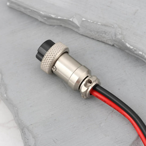 Close-up of Two Pin Core Radio Power Cable 1.2 Meter Long 12 V DC Lead for Kenwood TR 7400 VHF Transceiver on concrete surface.