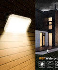 JUDYSSY Led Flood Lights Outdoor 30W, Ip67 Waterproof Garden Security Lights, 3 Pack mounted on wall in rain.