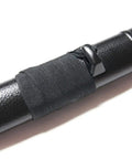 Close-up of Short Bokken Saya Scabbard For Practice Sword Black Plastic Iaido Saya With Kurigata, textured surface detail.