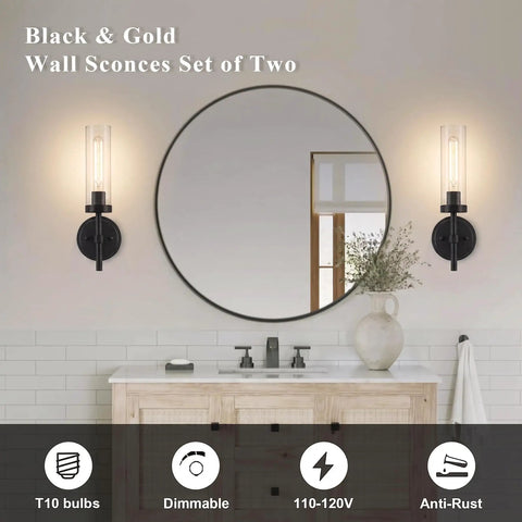 SANTOSTOCK Black Wall Sconces Set of Two with clear glass shades installed on bathroom wall next to round mirror.