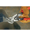 Compound Action Offset Long Cut Aviation Snips cutting through metal sheet by gloved hand, Heavy Duty Twelve And One Eighth Inch Length.