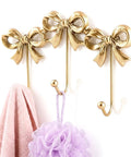 Heavy Duty Gold Bow Knot Wall Hooks Dope Brass Triple Coat Hanger Badass Metal Door Organizer Premium Weight Solid Built Storage Rig For Apartment Living Rooms with towels.