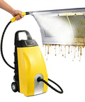 This bad boy is a 3000W Commercial Steam Cleaner That Hits 110 C And 5 Bar Pressure For Deep Cleaning, shown cleaning a greasy surface.