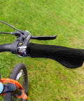 Bike with ergonomic grips on handlebars, showing shock absorption, dual-density silicone for ultimate comfort and universal 22.2mm fit.