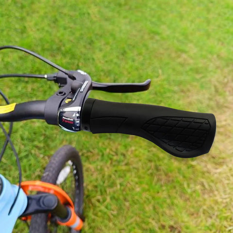 Bike with ergonomic grips on handlebars, showing shock absorption, dual-density silicone for ultimate comfort and universal 22.2mm fit.