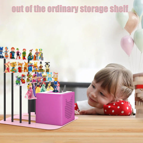 Ultimate Pink Metal Toniebox Stash Holder For 20 To 35 Tonies With Premium Magnetic Shelf desk stand with toys and child smiling.