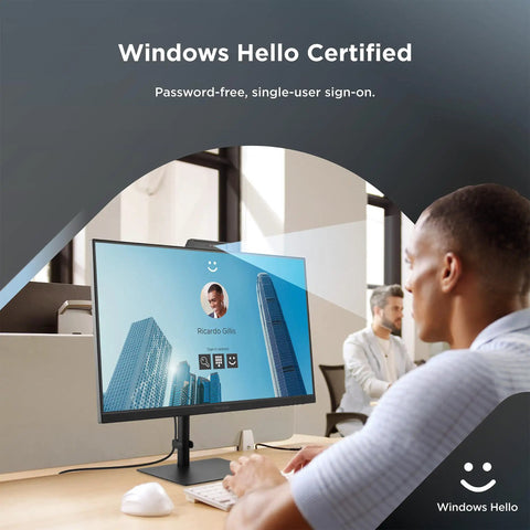 Man using 24 Inch IPS Webcam Monitor With 1080P Picture Built In Microphone And 5MP Privacy Camera Windows Hello Facial Recognition 120Hz Refresh Crystal Clear Video Calls Front Speakers USB C HDMI DisplayPort Ideal For Remote Work And Conferencing in office environment