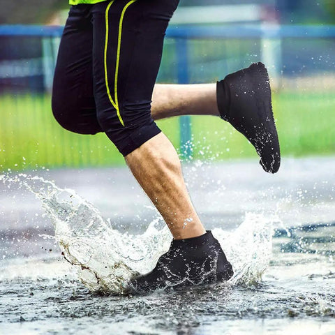 Person running in rain wearing Silicone Waterproof Shoe Covers With Zipper, Reusable Rain Overshoes, Non Slip Tread, Size L, Black