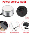 Mudder Silver Rotating Display Turntable Base For Epoxy Tumbler showing power supply connections for USB and battery options.