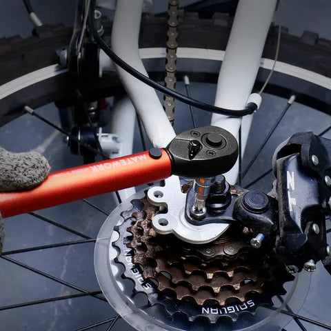 Quarter Inch Drive Torque Wrench Kit With 27 Piece Bike Tool Set Pro Grade Build High Precision 0.1Nm being used on bike gears