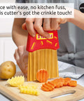 OTOTO Frizzle Crinkle Fry Cutter, front view; red handheld veggie cutter with vertical blades for crinkle fries.