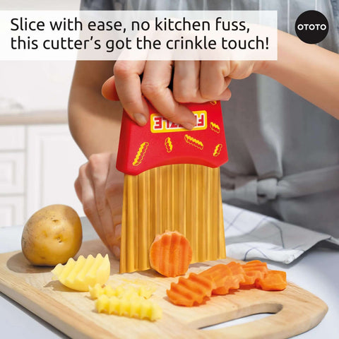 OTOTO Frizzle Crinkle Fry Cutter, front view; red handheld veggie cutter with vertical blades for crinkle fries.