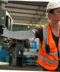 Heavy Duty Cut Resistant Arm Sleeves With Thumb Hole built tough as nails for welding and gardening, worn by a worker operating machinery.