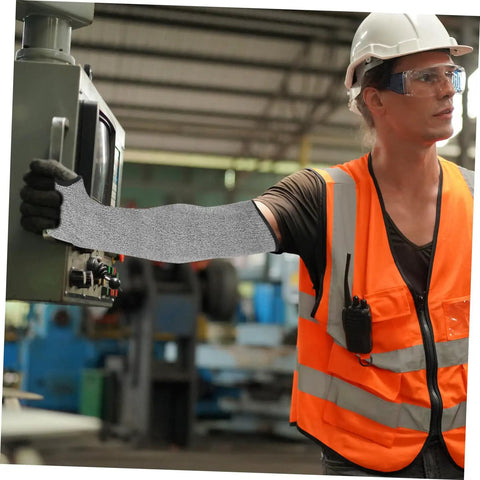 Heavy Duty Cut Resistant Arm Sleeves With Thumb Hole built tough as nails for welding and gardening, worn by a worker operating machinery.